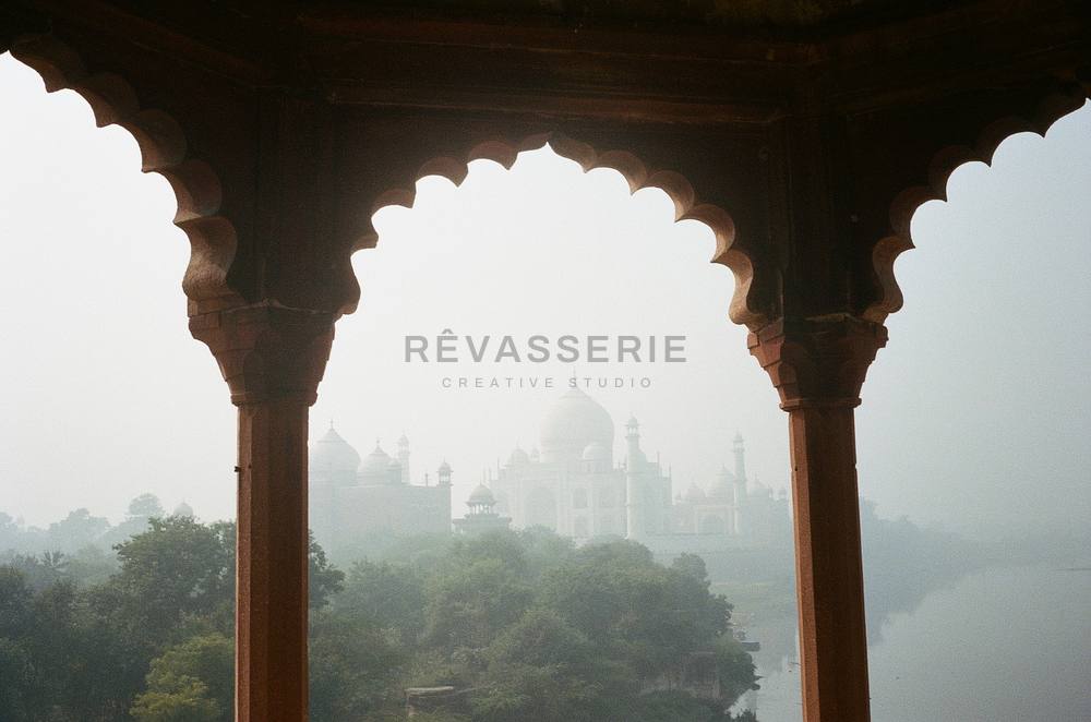 taj mahal framed by red sandstone arches from a quiet viewpoint in agra, 35mm film