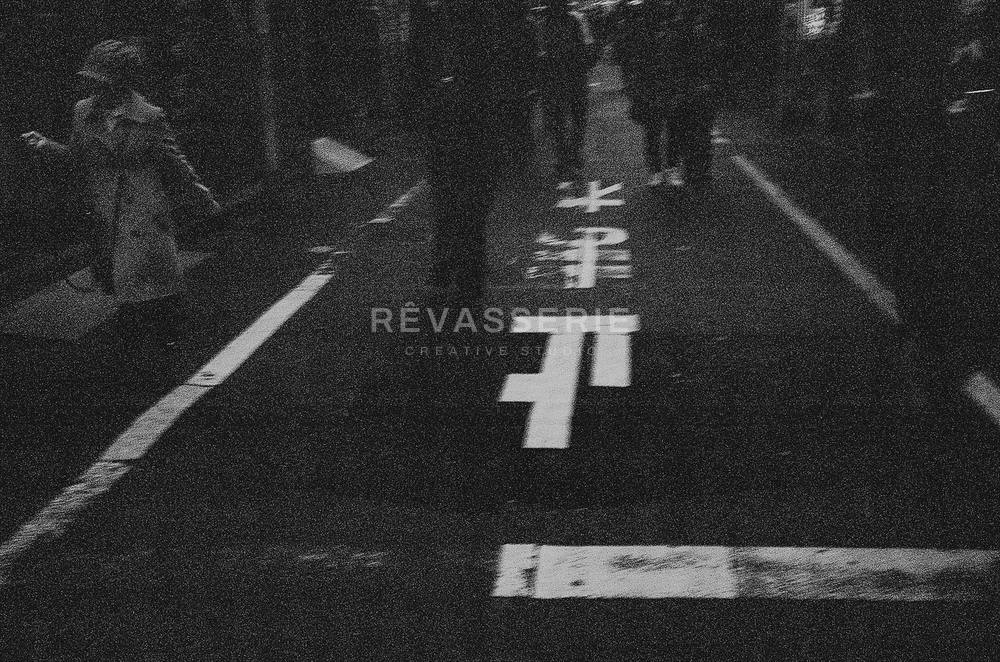 tomare stop sign painted on a tokyo street in black and white, 35mm film photography